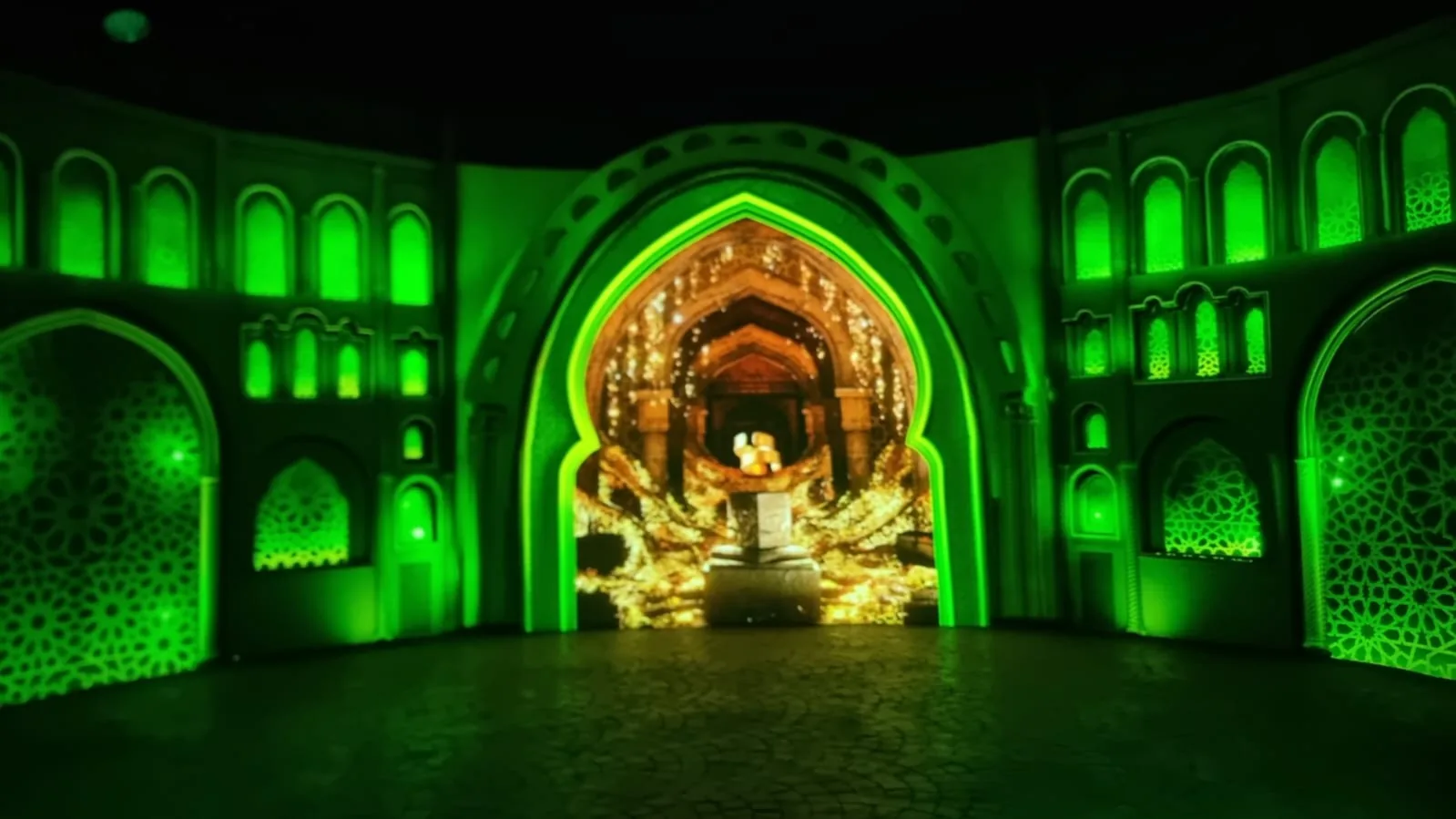Final green and gold playback across the same architectural projection environment.