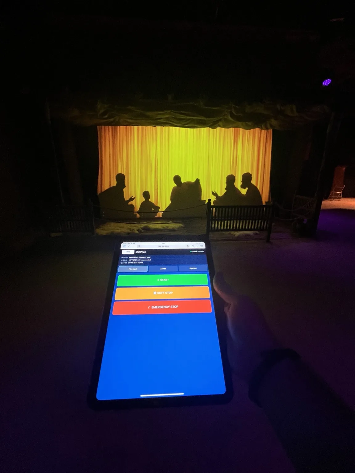 Wi-Fi tablet running the show-control interface in front of an active scene.