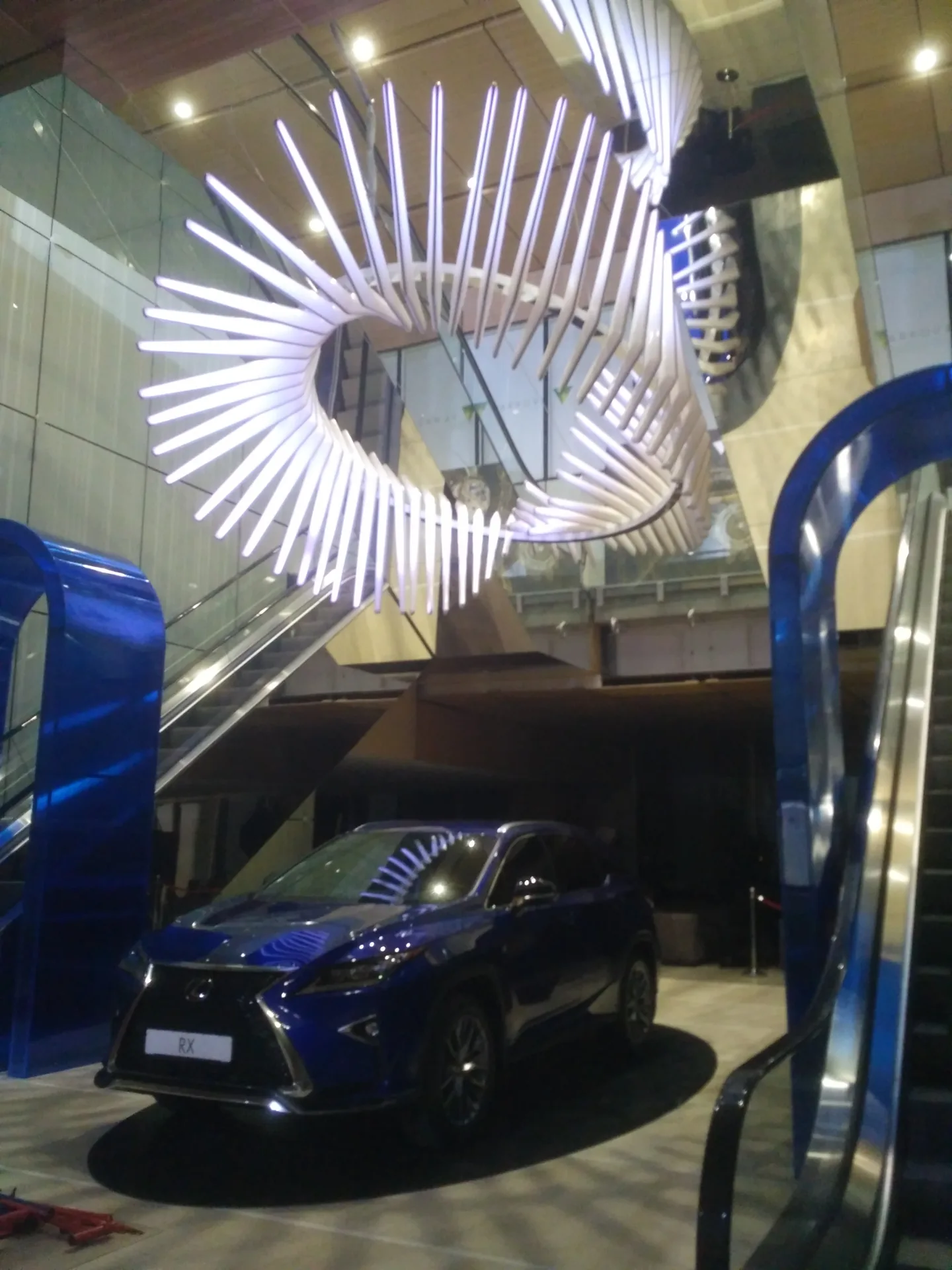 Lexus RX displayed beneath the completed light art installation.